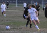 Lemoore's Chloe Chedester keeps her eye on the ball. Her Tigers struggled to a tie with Golden West on Thursday, Jan. 14.